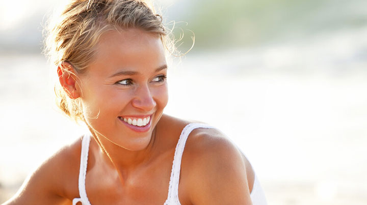bright white smile woman tanned