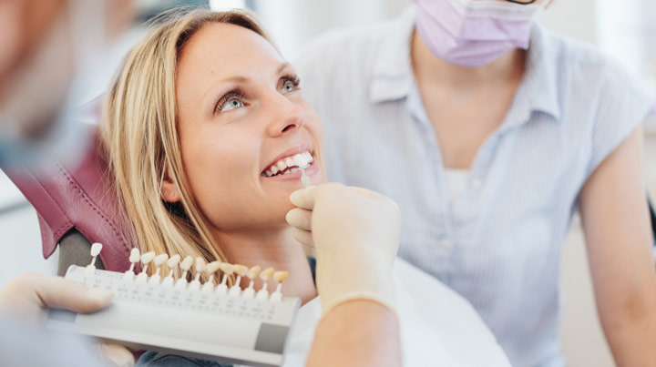 woman testing dental veneers