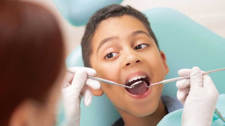 smiling boy dentist checkup