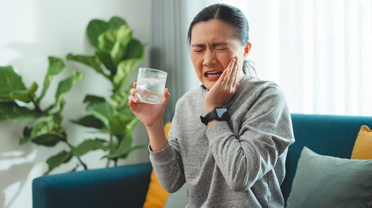 woman tooth sensitivity after cold water