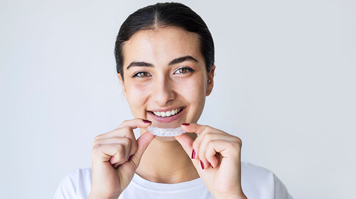 woman smiling with night guard